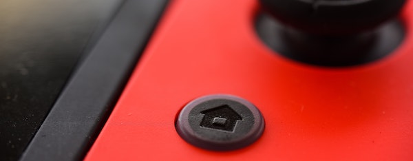 Home button on the Nintendo Switch gaming console — Photo by Daniel Hooper on Unsplash
