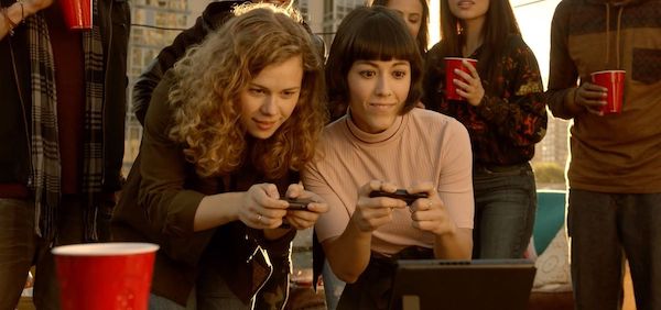 People playing Nintendo Switch on rooftop
